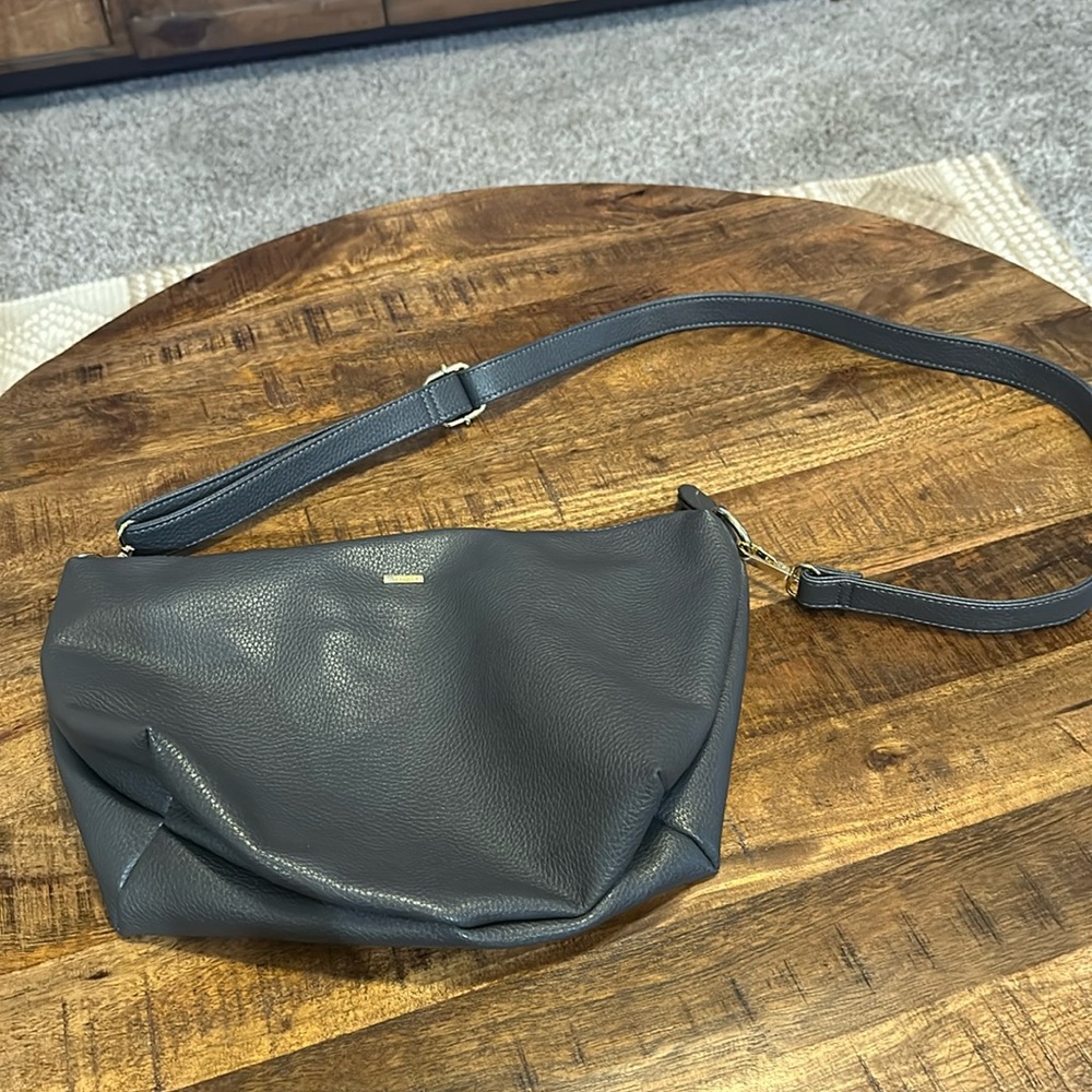 Medium sized grey crossbody bag with adjustable strap
